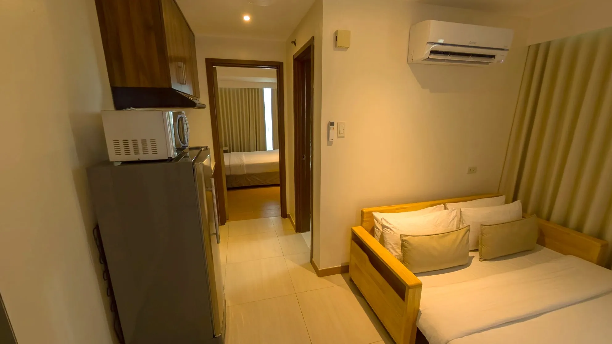 One Bedroom Standard Room living area with a sofa bed and kitchenette