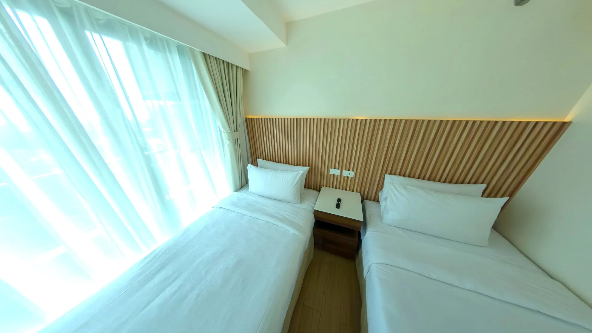 Two Bedroom Standard Room twin bedroom with a large window